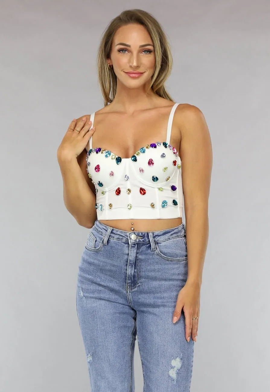Weißes Bustier mit großen mehrfarbigen Strasssteinen